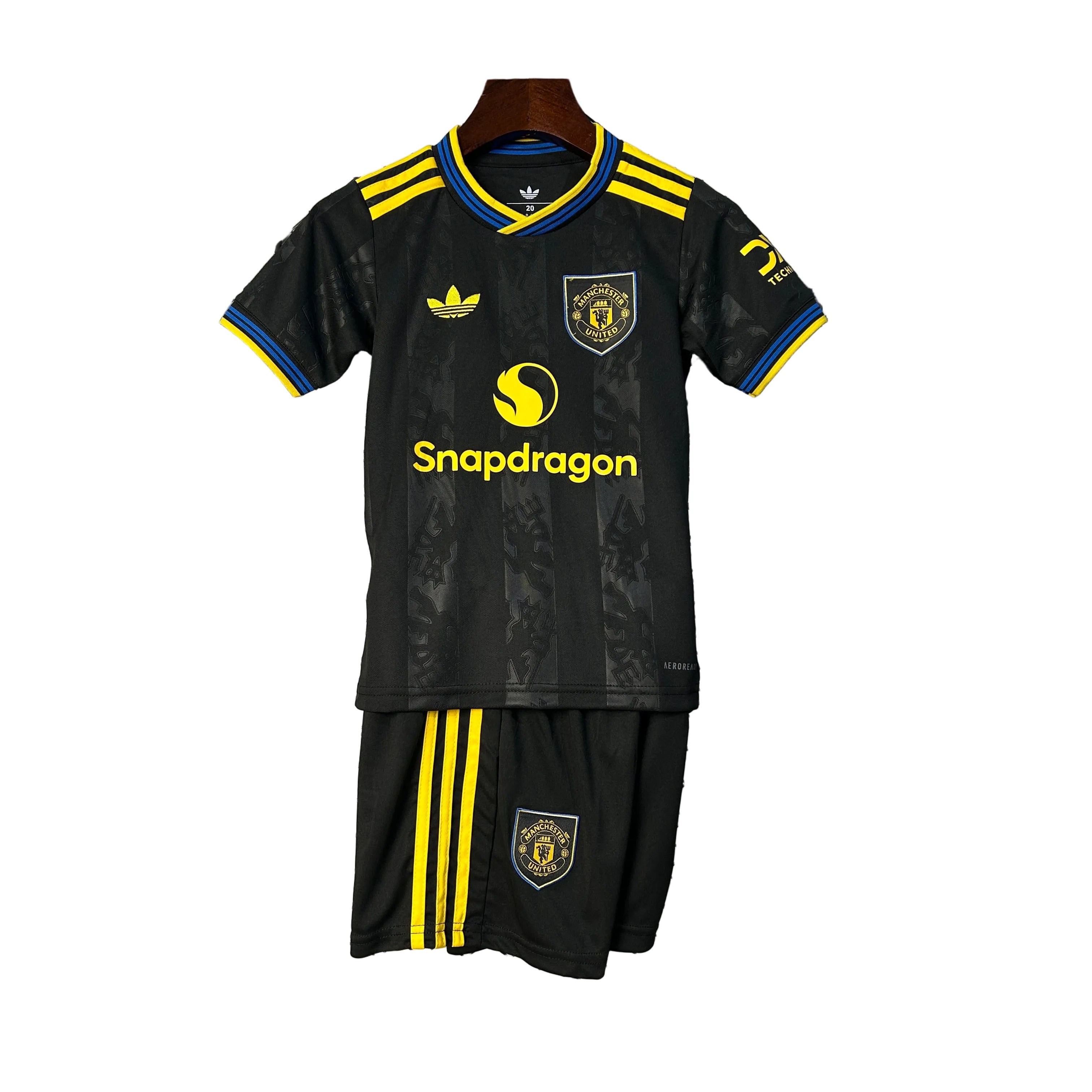 KIT INFANTIL DO MANCHESTER UNITED 25/26 PRETO